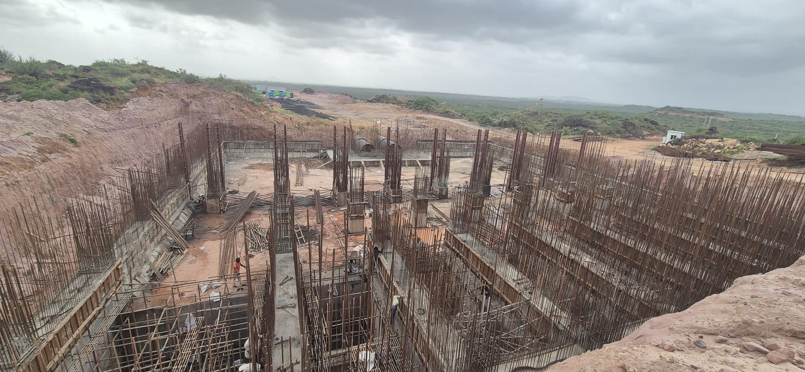 Large excavated irrigation reservoir structure with RCC columns and reinforcement