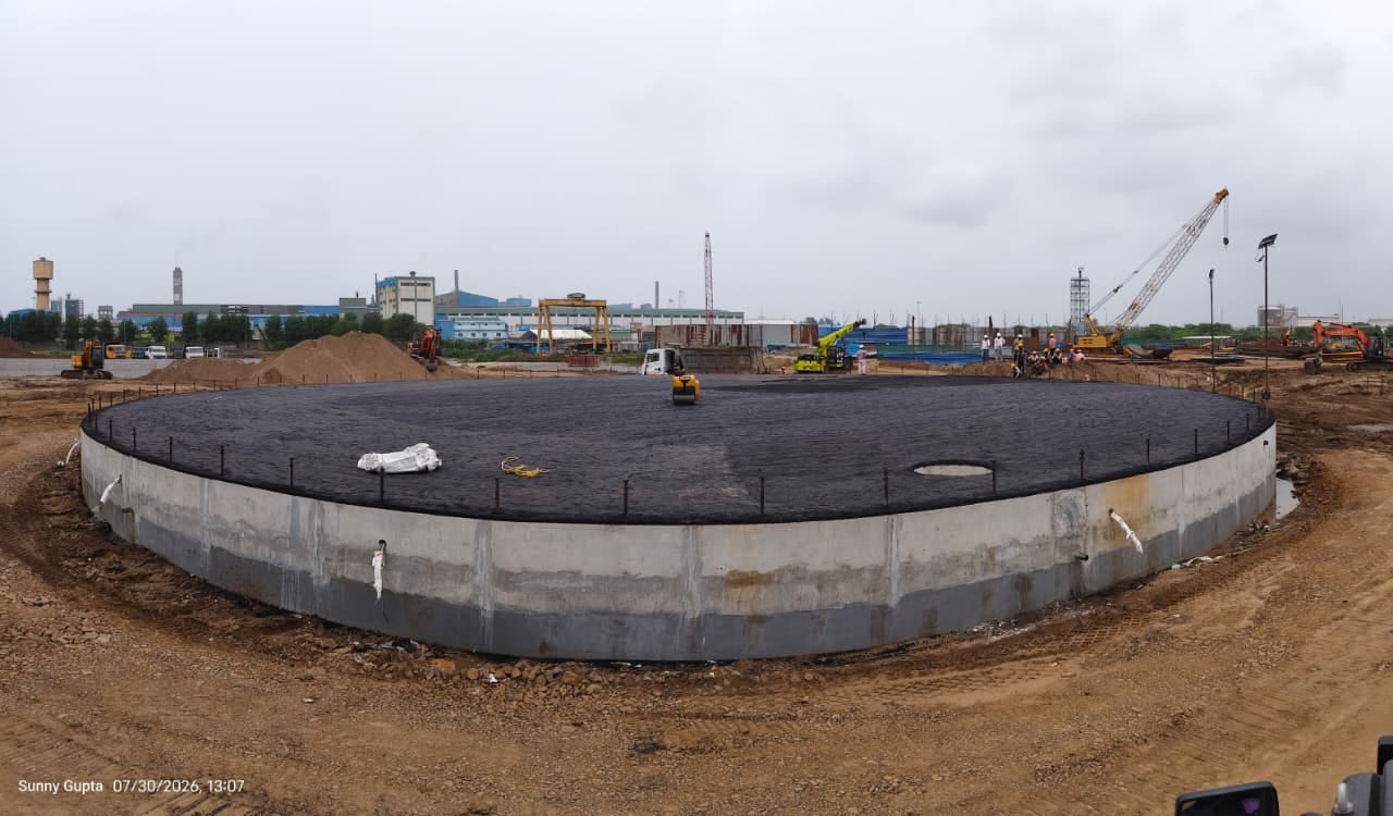 Large circular RCC storage-tank foundation under construction at an industrial plant
